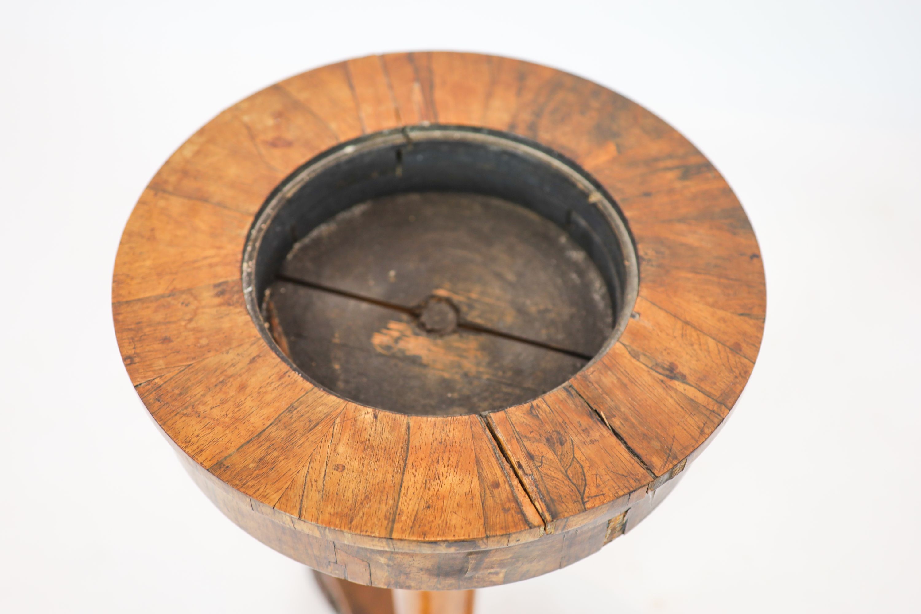 A Regency banded rosewood circular topped work table, raised on tapered, turned pillar, on a triform platform base, diameter 40cm, height 75cm